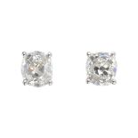 A pair of 18ct gold old-cut diamond stud earrings. Estimated total diamond weight 1.70cts, I-K