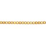 A sapphire and diamond bracelet. Designed as a series of oval-shape yellow sapphires, with