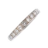 A diamond full eternity ring. The single-cut diamond line, with scrolling engraved sides.