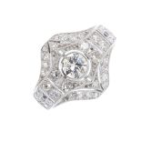A diamond dress ring. Of geometric design, the brilliant-cut diamond collet, with single-cut diamond