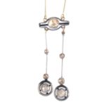 A diamond negligee necklace. The rose-cut diamond asymmetric drops, with halo terminals, suspended