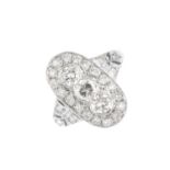 A diamond dress ring. The brilliant-cut diamond oval-shape cluster, with similarly-cut diamond