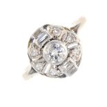 A diamond cluster ring. The brilliant-cut diamond, with baguette-cut diamond sides and single-cut