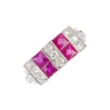 A diamond and ruby dress ring. Designed as a series of alternating square-shape ruby and brilliant-