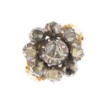 A late Georgian silver and gold diamond ring. The rose-cut diamond floral cluster, to the