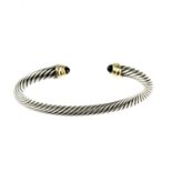 DAVID YURMAN - a gem-set bangle. A torque style bangle with rope-twist texture, to the banded
