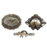 Ten late 19th to early 20th century silver brooches. To include a Mizpah brooch, designed as a