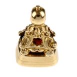 A carnelian fob. The rectangular gem panel intaglio engraved with two initials, to the banded