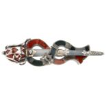 A mid Victorian silver and agate sword brooch. Designed as a sword, the pommel set with red agate,