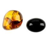 Two pieces of natural Dominican Republic amber with insect inclusions and a piece of simetite. The