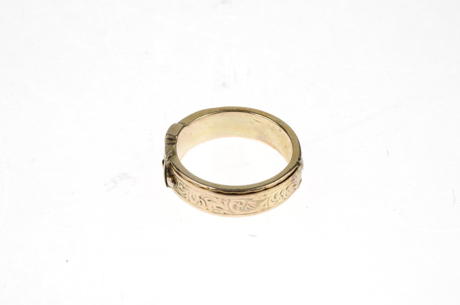 A late Victorian buckle ring. With foliate engraving to the full ring, hinged on two sides and - Image 4 of 5