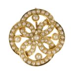 A split pearl brooch. Of quatrefoil shape, set with split pearls and a central seed pearl, can