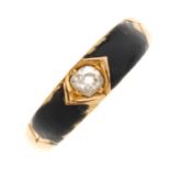 A late Victorian 18ct gold diamond and enamel ring. Designed as a cushion shape diamond to a black