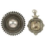 Seven items of late 19th to early 20th century silver jewellery. To include a medallion, a Charles