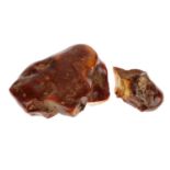 A piece of natural amber. Separated into two pieces which fit together and appear to have cracked