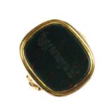 A late 19th century gold bloodstone signet ring. The intaglio engraved rectangular bloodstone