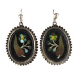 A pair of late 19th century pietra dura earrings. Of oval outline, the onyx panels inlaid with