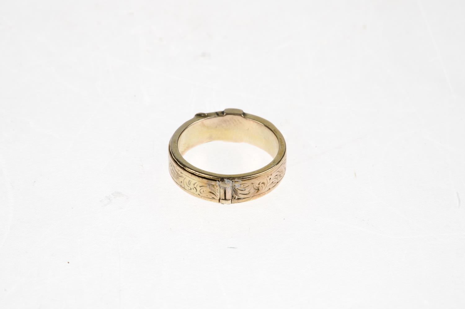 A late Victorian buckle ring. With foliate engraving to the full ring, hinged on two sides and - Image 2 of 5