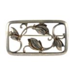 GEORG JENSEN - a brooch. Of rectangular outline, the openwork design of four flower shapes. Signed