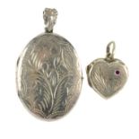 A selection of silver and white metal lockets. To include an oval shape locket with applied bird