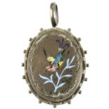 A late Victorian silver and enamel locket. Of oval outline, the front with inlaid enamel detail