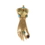 A late Victorian gem set hand pendant. The outstretched fingers set with a turquoise cabochon to the