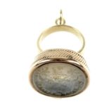 A chalcedony carved intaglio fob. Of oval outline, the intaglio carved chalcedony panel depicting