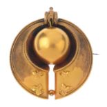 A late Victorian gold brooch. The spherical bead, hinged within a tapered surmount, with rope-