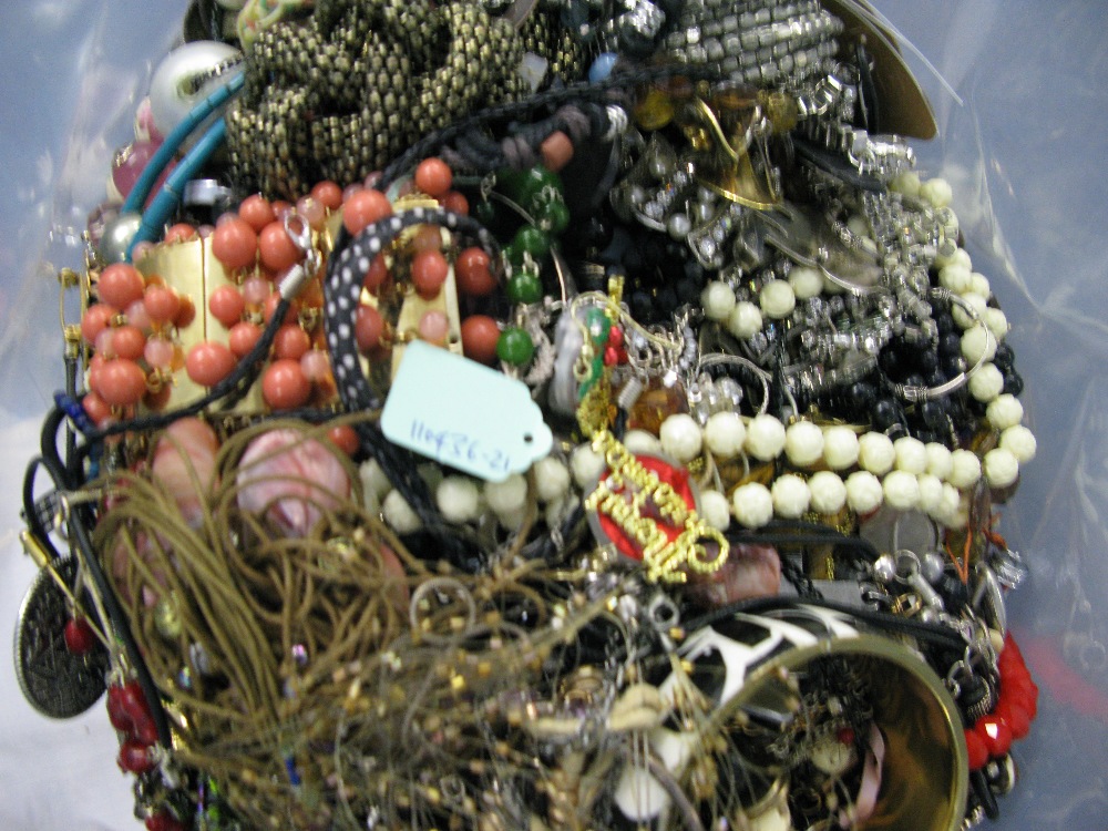 A bag containing a large quantity of costume jewellery. Many AF. Weight approximately 13.5kg. Due to - Image 2 of 2