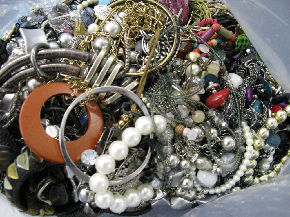 A bag containing a large quantity of costume jewellery. Many AF. Weight approximately 11kg. Due to - Image 2 of 2