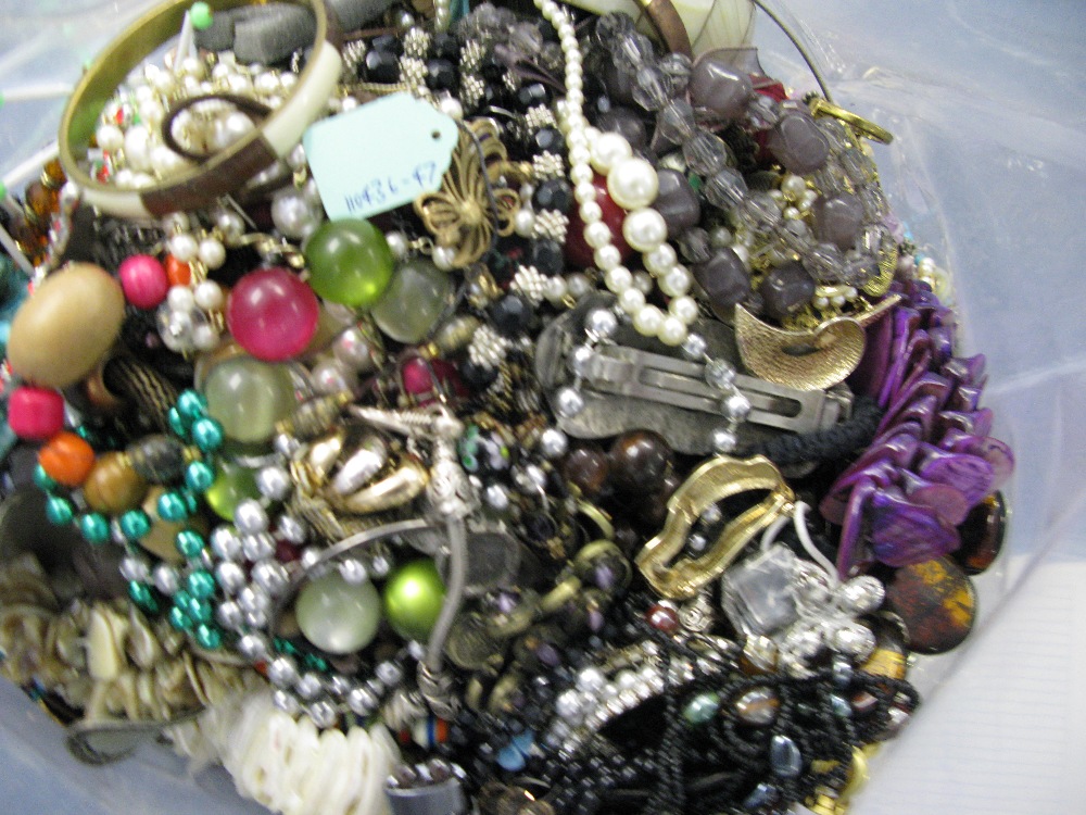 A bag containing a large quantity of costume jewellery. Many AF. Weight approximately 12kg. Due to - Image 2 of 2