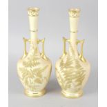 A pair of Royal Worcester bone china vases, the blush ivory grounds decorated with ferns, with