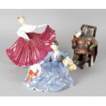 A collection of fourteen Royal Doulton figurines, comprising Daydreams HN1731, Top O' The Hill