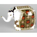 A Royal Crown Derby porcelain paperweight modelled as an elephant, with red printed marks and gold