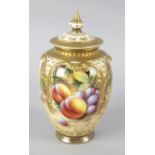 A Royal Worcester bone china vase, with pierced cover hand painted with fruit, signed Richards. 6.25