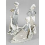 Five Lladro figurines. Comprising: a goose girl; another similar with duck drinking from a pail; a