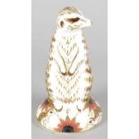 A Royal Crown Derby porcelain paperweight modelled as a meerkat, with red printed marks and gold