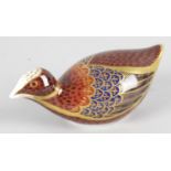 A Royal Crown Derby porcelain paperweight modelled as a quail. with red printed marks and gold