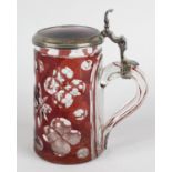 A ruby flashed glass tankard with silver mounted lid hallmarked London 1889 Edward Barnard & Sons,