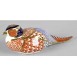 A Royal Crown Derby porcelain paperweight modelled as a pheasant, with red printed marks and gold