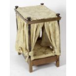 A dolls four poster bed, with turned uprights and wooden frame, gold damask drapes and mattress,