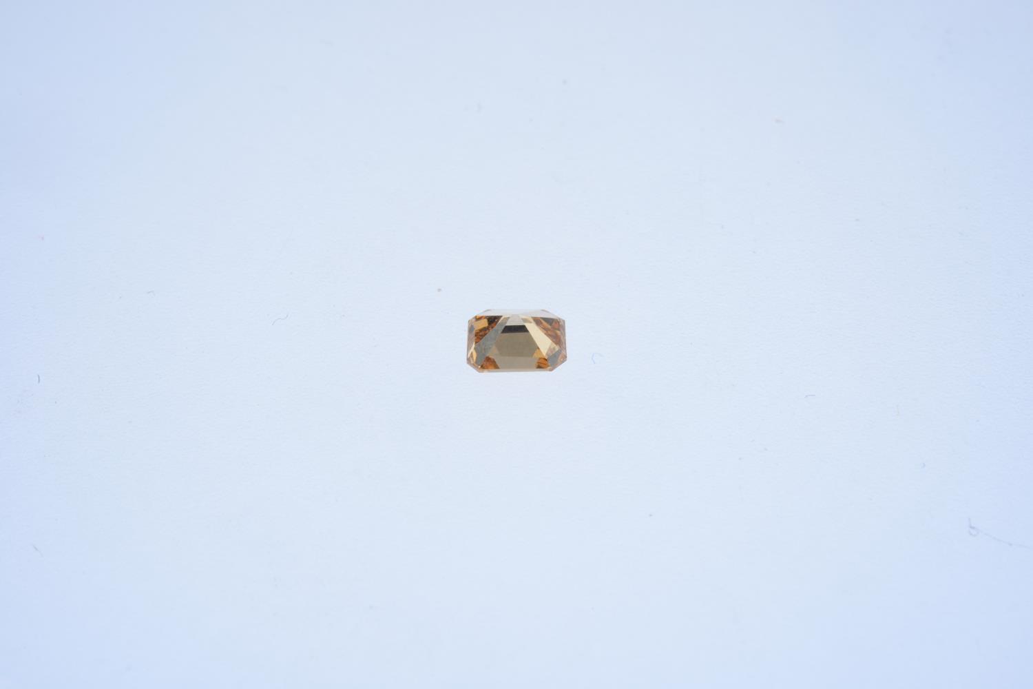 A rectangular-shape coloured diamond, weighing 0.59ct. Estimated fancy dark brown yellowish - Image 2 of 2