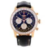 BREITLING - a gentleman's Navitimer chronograph wrist watch. 18ct rose gold case with inner slide