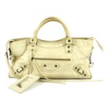 BALENCIAGA - a cream Part-Time handbag. Crafted from crinkled cream lambskin leather, featuring