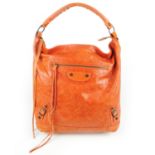 BALENCIAGA - a Classic Day handbag. Crafted from glazed orange lambskin leather, featuring maker's