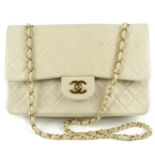 CHANEL - a vintage Medium Classic Double Flap handbag. Featuring maker's beige quilted lambskin