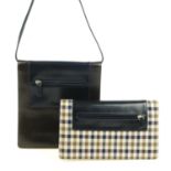 AQUASCUTUM - two handbags. Both of a similar design, featuring a front zip pocket with maker's