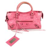 BALENCIAGA - a pink Part-Time handbag. Crafted from distressed pink lambskin leather, featuring