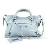 BALENCIAGA - a light blue Classic City handbag. Crafted from glazed light blue lambskin leather,