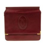 CARTIER - a reversible Bordeaux messenger handbag. With front and rear compartments, double magnetic